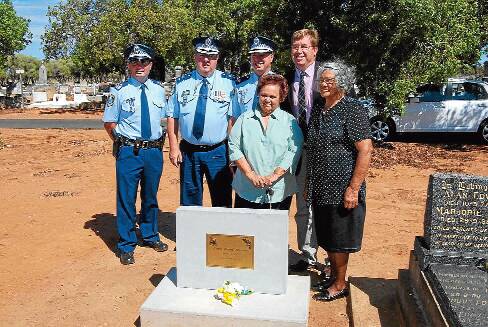 Sergeant Darren Wilkins, Superintendent Stan Single, Assistant Commissioner Geoff McKechnie, Dubbo MP Troy Grant (back) and descendants of Aboriginal tracker Jimmy Nyrang Ruth Carney and Violet Lousick after the unveiling of the headstone.	Photo: FAYE WHEELER