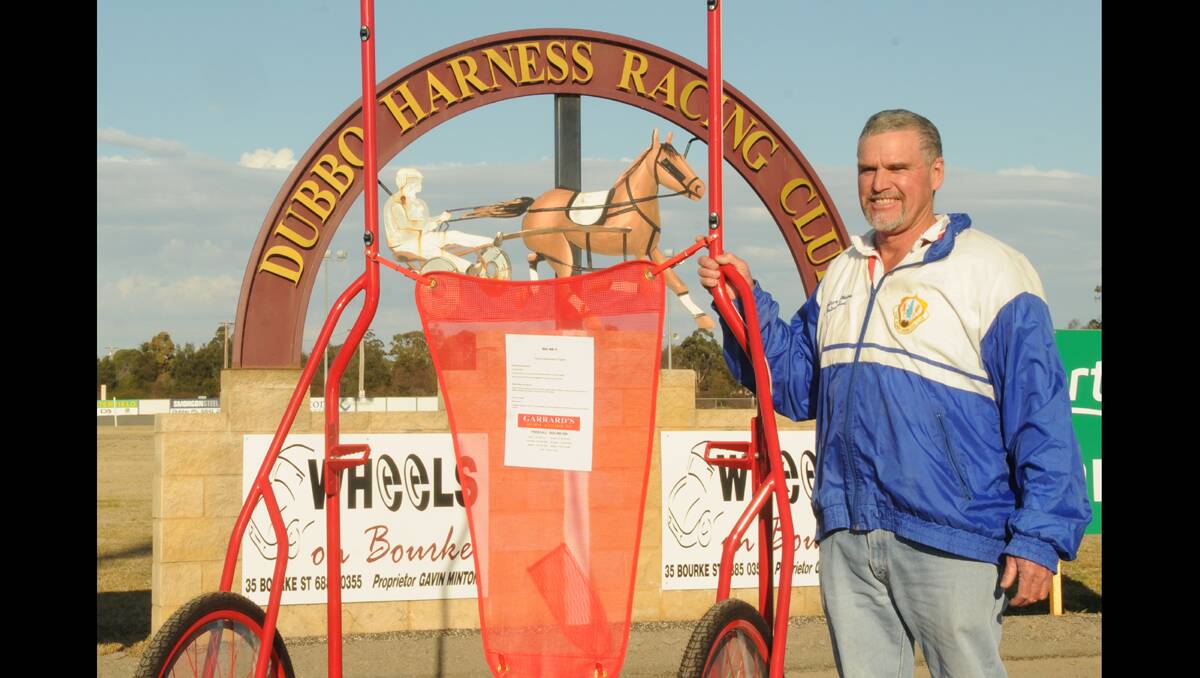 IN THE GIG: Dubbo Harness Racing Club director Lester Hoy with the Garrard’s Horse and Hound gig one lucky trainer will walk away with after tomorrow night’s race.	Photo: AMY MCINTYRE