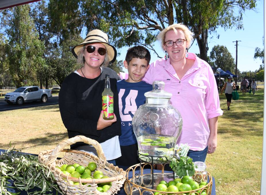 LIME LOVERS: Joh Leader, Henry Wilson and Mel Singh at the LeaderLife lime cordial stand. Picture: AMY MCINTYRE