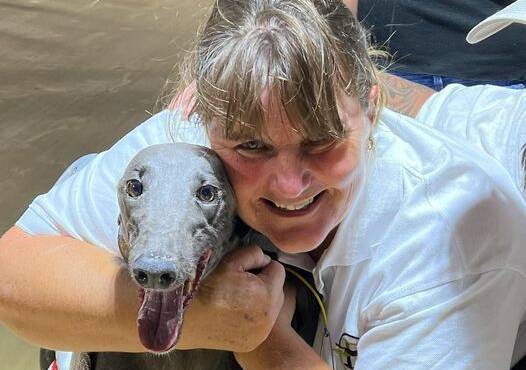 ALL SMILES: Melinda Finn and Zipping Kyrgios after the win at Dubbo on Saturday night. Picture: DUBBO GREYHOUNDS