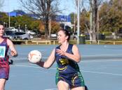 Macquarie's Michelle Williams looks for options during her sides win over St Thunder on Saturday. Picture: Amy McIntyre