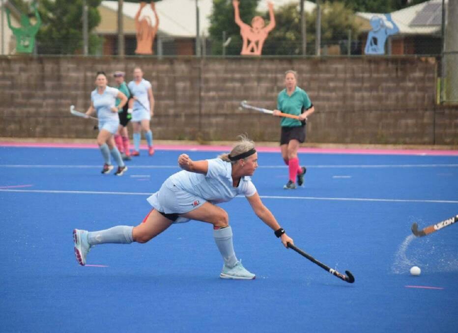 ON THE MOVE: Deb Robinson from Dubbo goes for a block in the successful Masters of the Bush hockey carnival over the weekend. Photo: CONTRIBUTED