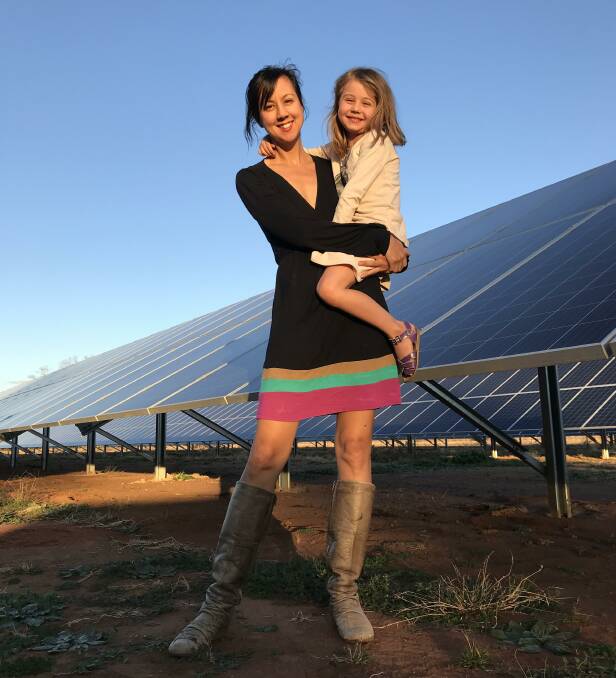 LOCALS: Narromine's Karin Stark with her daughter Noa in front of their solar panels. Picture: CONTRIBUTED
