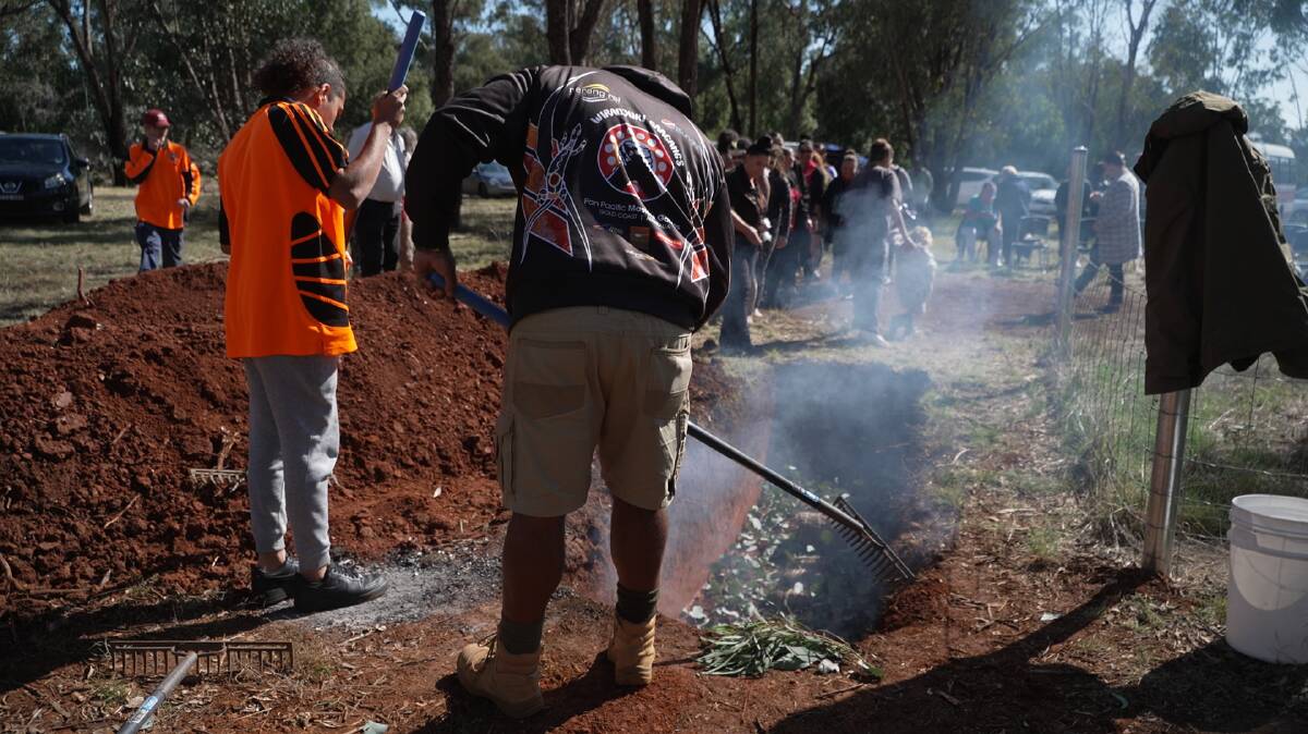 TRADITION: Members of the local community buried four the bodies of four Aboriginal ancestors. Picture: CONTRIBUTED