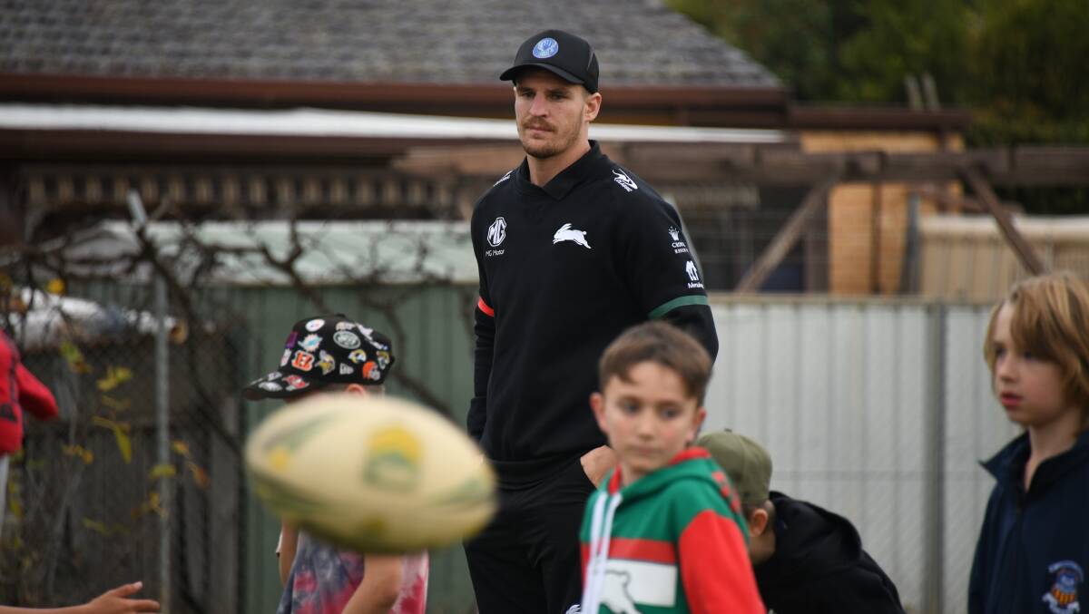 WATCHFUL: South Sydney Rabbitoh Jed Cartwright watches over local juniors. Picture: AMY MCINTYRE