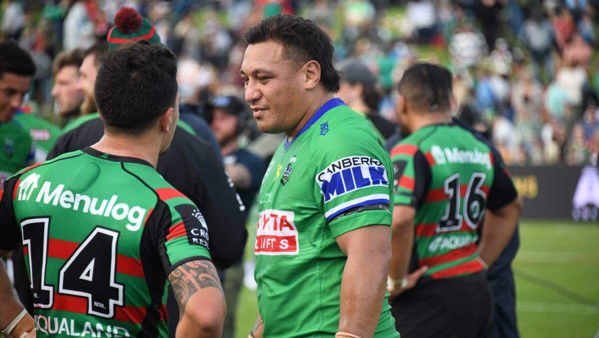 MILESTONE MAN: Josh Papalii chats with South Sydney's Kodi Nikorima after the Raiders win over the Rabbitohs on Sunday. Picture: AMY MCINTYRE
