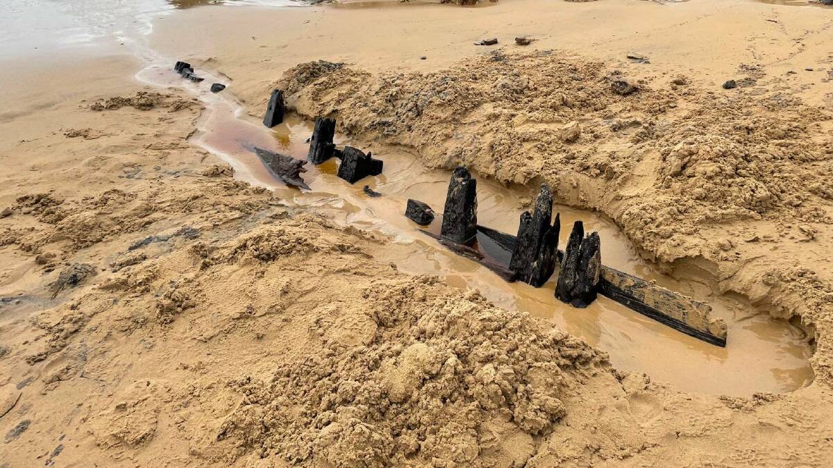 The remains of a mysterious shipwreck on Nelsons Beach were discovered over the weekend by some eager Bega Valley locals. Photo curtesy of the Constable family, taken on Sunday April 3, 2022. 