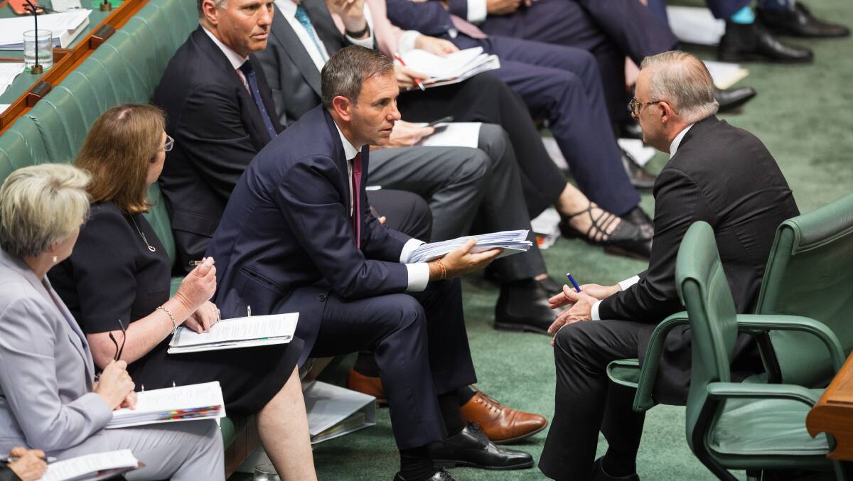 Treasurer Jim Chalmers talking with Prime Minister Anthony Albanese during Question Time. Picture by Sitthixay Ditthavong