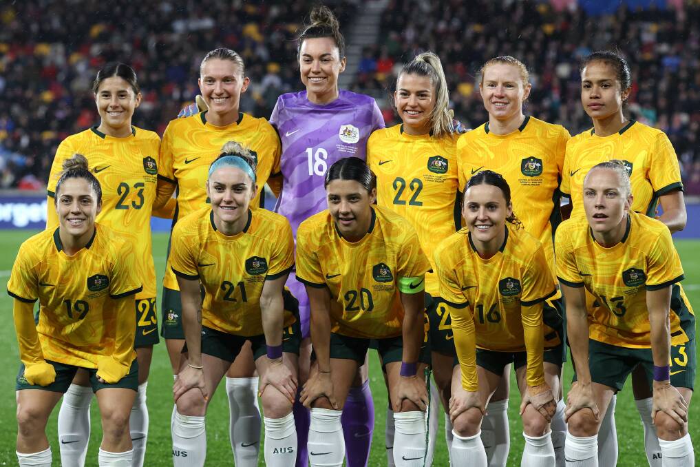 Clare Hunt (back, second from left), Ellie Carpenter (front, second from left) and Tameka Yallop (front, far right) line-up ahead of the Matildas' friendly against England in April, 2023. Picture by Charlotte Wilson/Getty Images