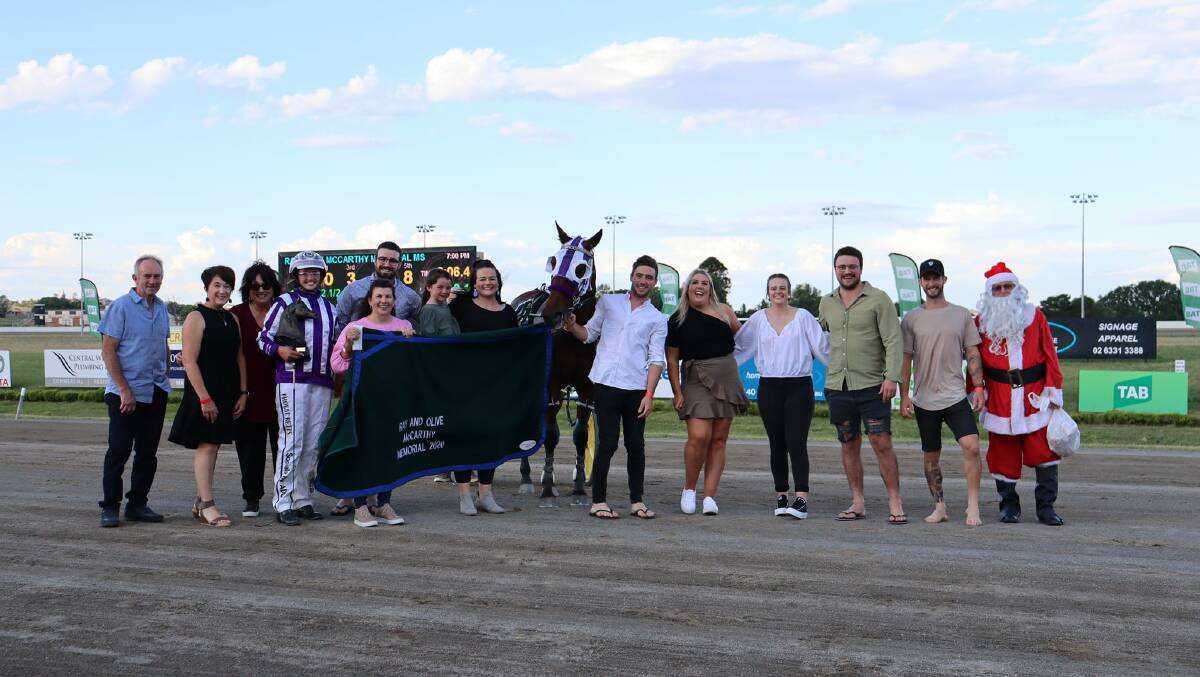 Phoebe Betts and Snoop Stride with their fan club after winning the Ray and Olive McCarthy Memorial at the Bathurst Harness Racing Club. Picture: Bathurst Harness Racing Club