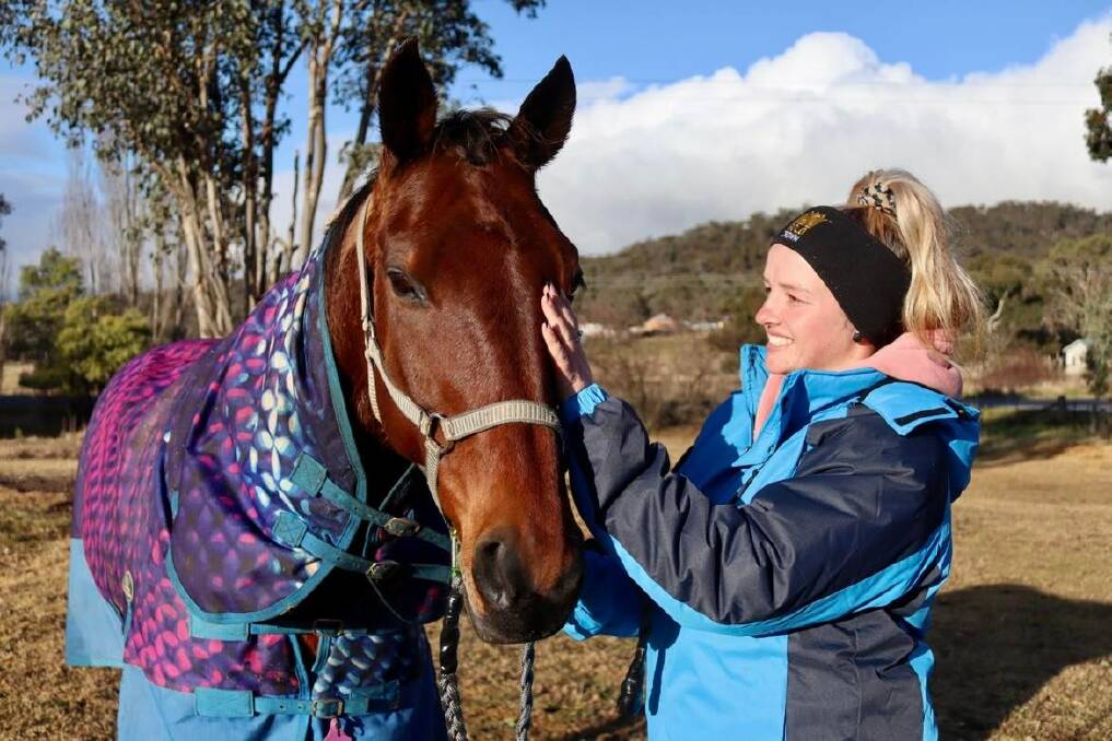 Phoebe Betts retires the first horse she ever owned, Snoop Stride. Picture: Amy Rees