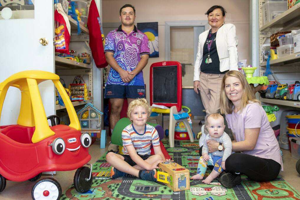 Campbell Watts and Michelle Redden from Connecting Community Services with the Orana Toy Library's Emily Bell with children Robbie and Toby. Picture by Belinda Soole
