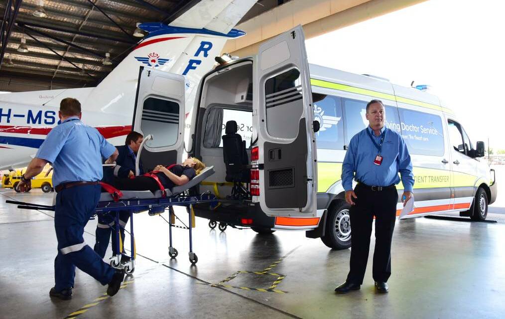 Dubbo RFDS base staff demonstrate a patient transfer system at Dubbo airport. Picture by Belinda Soole