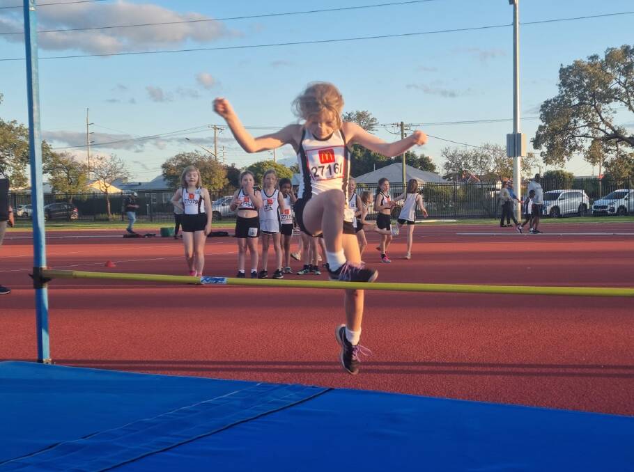 A Little Athletics participant takes part in the high jump as the Dubbo Athletics Club's 65th season begins. Picture supplied