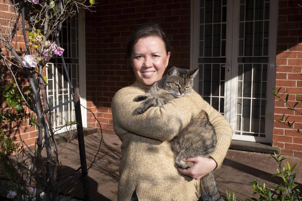 Animal Justice Party Convener Julie Power outside her Dubbo home with her cat Jelly. Picture: Belinda Soole