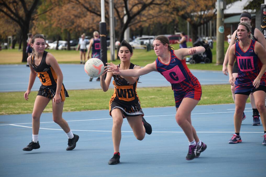 'A TOUGH SEASON': Nyngan Cougars Wing Defence Shania Dutschky and St Groovers Centre Eve Bailey during Saturday's game. Picture: Amy McIntyre