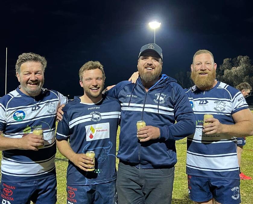 Lawrence Mooney (left) with members of the Bogan Bulls rugby club on his recent visit to Nyngan. Picture: Facebook/Bogan Bulls