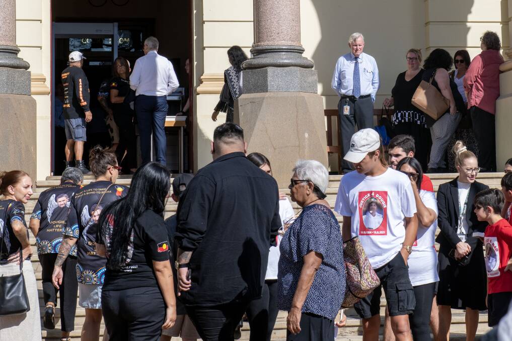 Friends and family of Ricky Hampson Jr as well as hospital staff enter Dubbo court for the first day of the inquest into his death. Picture by Belinda Soole
