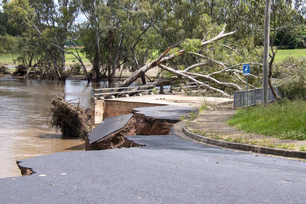 The crumbling road leading up to the Duke of Wellington bridge at the time of the floods in 2022. Picture by Belinda Soole