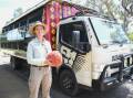 Taronga Western Plains Zoo visitor experience officer Linzi Aland with the truck she drives for the Pride Lands Patrol tour. Picture by Laurie Bullock