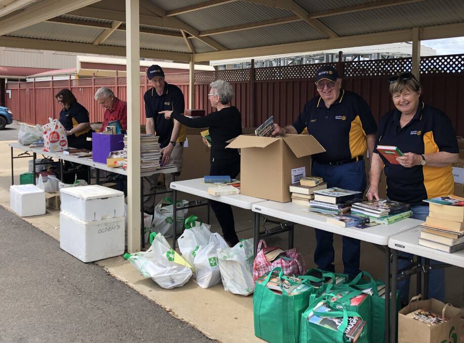 Dubbo West Rotary Club sort and pack preloved books at the book drive on Saturday. Picture supplied
