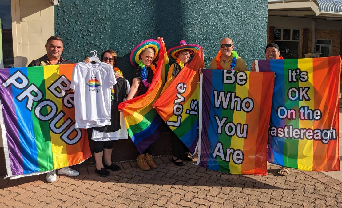 Organisers of Coonabrabran's first ever pride event with rainbow flags which will be put up on the town's main strip. Photo courtesy of Coonabarabran Times