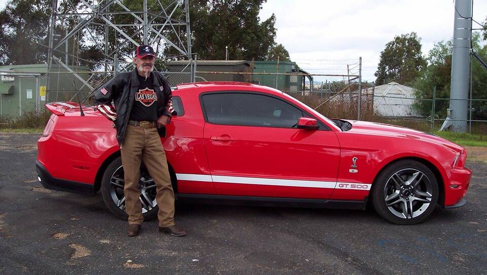 Missing and presumed murdered man Robert Dickie with his beloved red Mustang. Picture supplied