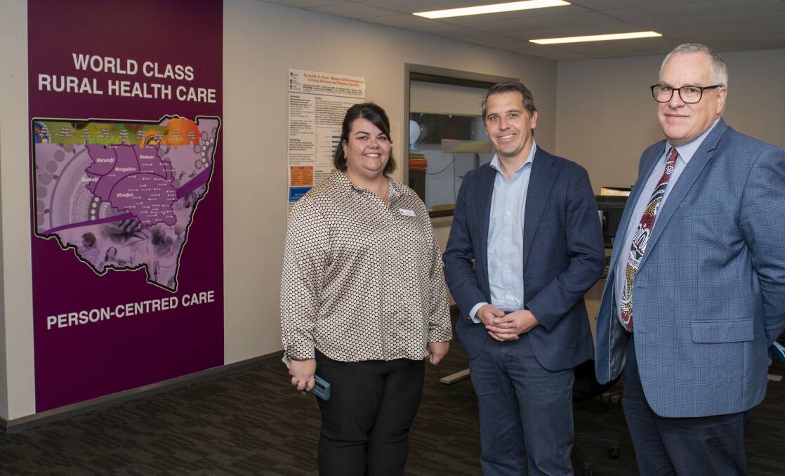 Health minister Ryan park (centre) with Dara Hobson, Acting General Manager of vCare and Mark Spittal, Chief Executive of the Western NSW LHD. Picture by Belinda Soole