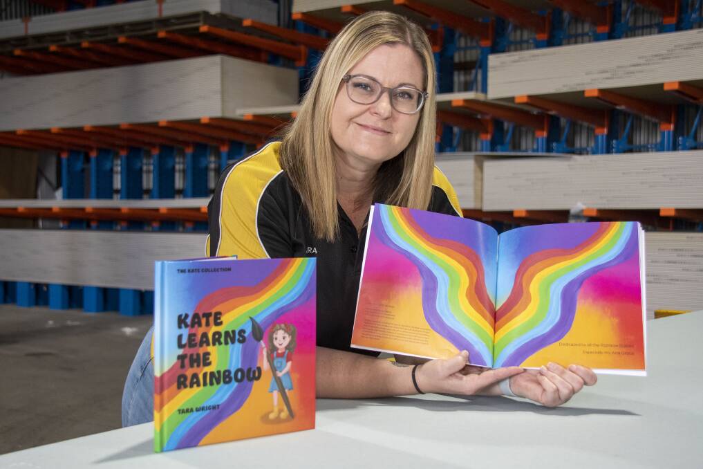 Tara Wright with her first book 'Kate Learns the Rainbow'. In her day job she works for a plastering company. Picture by Belinda Soole
