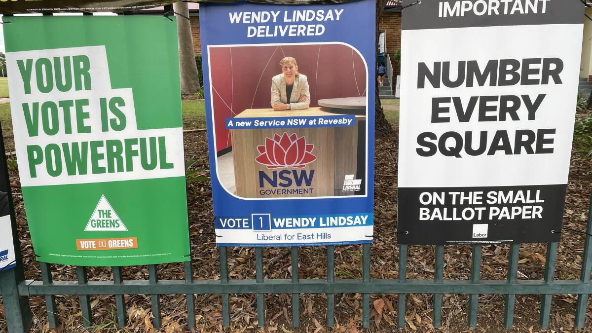 The election poster for East Hills Liberal member Wendy Lindsay at Panania Public School carries the NSW government logo. Picture by Saffron Howden
