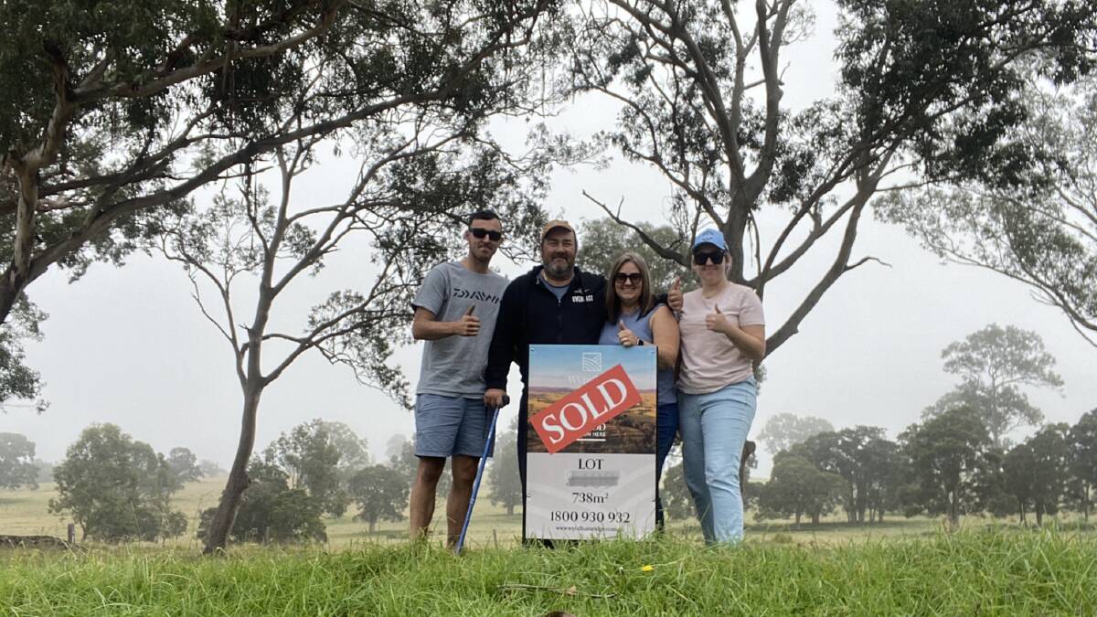 Alanna Tomazin with her brother Nicolas, mother Annmarie, and father Mitch when she and Nicolas bought a property on which to build the family home in the NSW Hunter region. Picture: Supplied