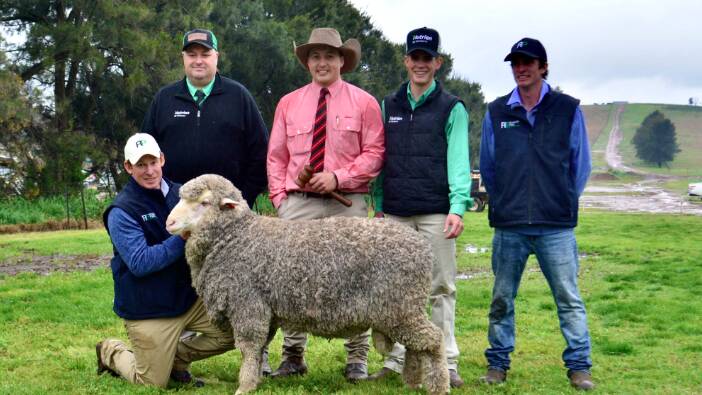 The $28,000 top-priced ram with Matthew and Charlie (right) Coddington of Roseville Park, Dubbo, buyers' representative Brad Wilson, Nutrien stud stock, Dubbo, auctioneer Lincoln McKinlay, Elders stud stock, Inverell, and Jack Simmons, Nutrien Armidale. Picture: Hannah Powe