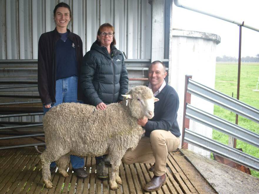 Edwina Sleigh, Ruffy, with Anna Toland and Simon Riddle, Toland Merinos, Violet Town, and one of the two top-priced rams that sold for $10,500 each. Picture: Andrew Miller.