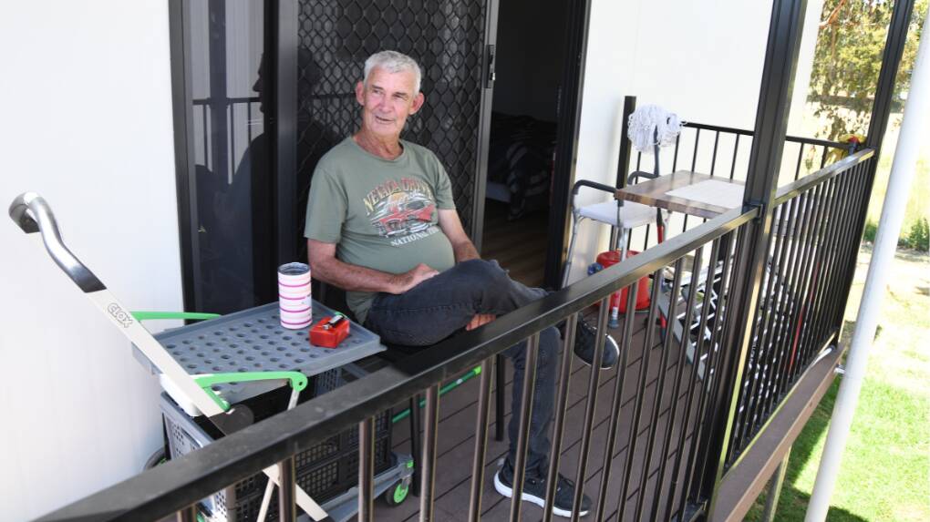 Eugowra resident Ken Woodford sits out the front of his pod home on Evelyn Street on Tuesday, October 24. Picture by Jude Keogh.