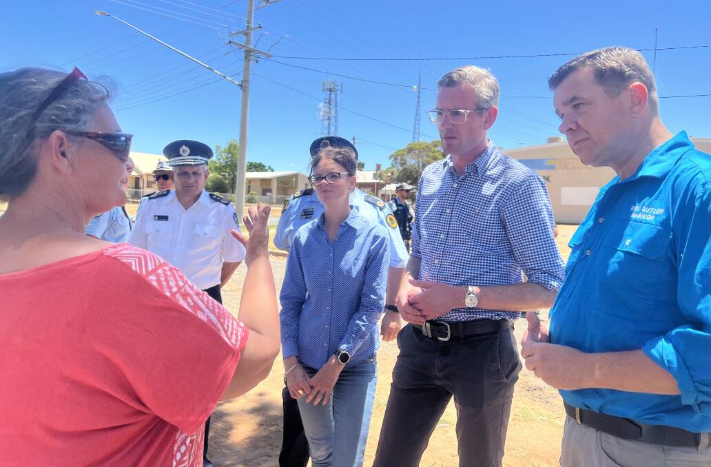 A Menindee resident discussing the flood with Barwon MP Roy Butler (right), NSW premier Dominic Perrottet (middle), emergency services minister Steph Cooke and State Emergency Services and NSW Police on Saturday, January 7. Picture Supplied