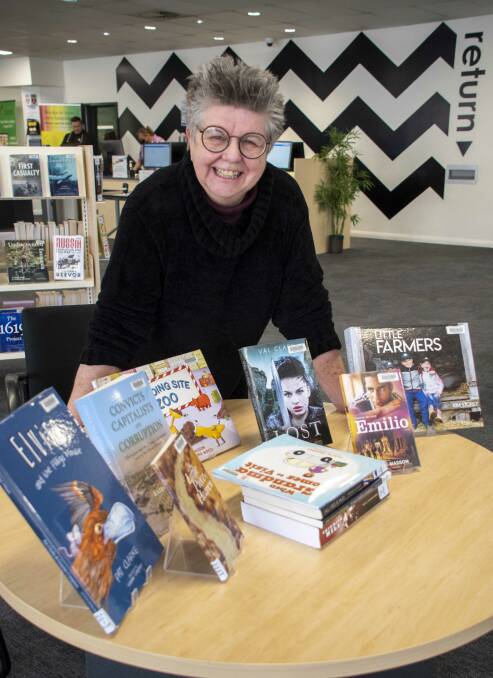 Dubbo author and art teacher Val Clark at the Macquarie Regional Library preparing display for the Dubbo Writers Festival opening on Friday, 9 September at 6pm. Picture by Belinda Soole