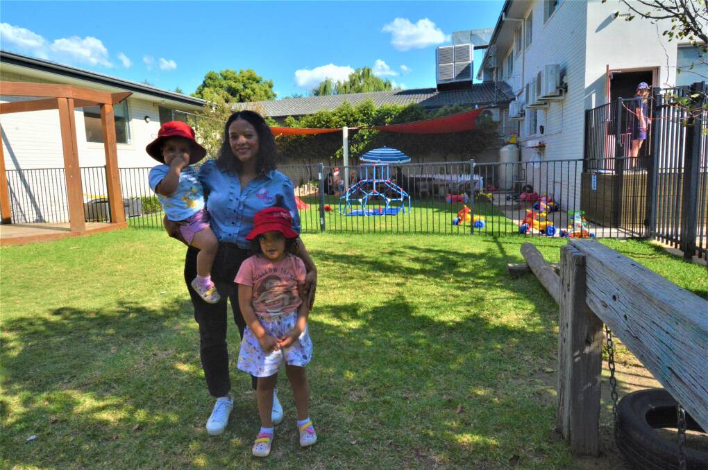 Karoline Hughes with Leilani and Queenie at Redgum Childcare Centre on Fitzroy Street. PHOTO: ELIZABETH FRIAS
