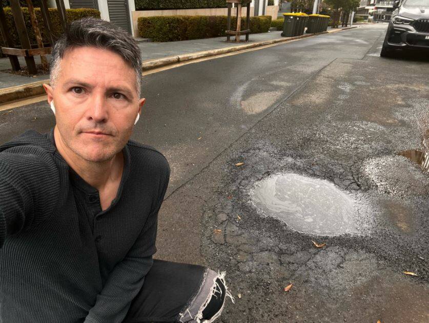 EMBRACING TECHNOLOGY: NSW Minister Victor Dominello shows potholes a sensor camera has picked up. Picture: SUPPLIED