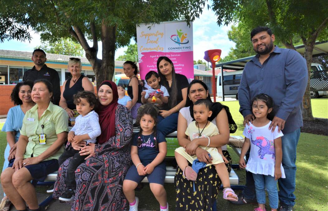 The migrant families with their children at Dubbo South Public School's Schools as Community Centre playgroup on Wednesdays with migrant support worker Khaled Taleb and SaCC coordinator Lorna Brennan. Picture by Elizabeth Frias
