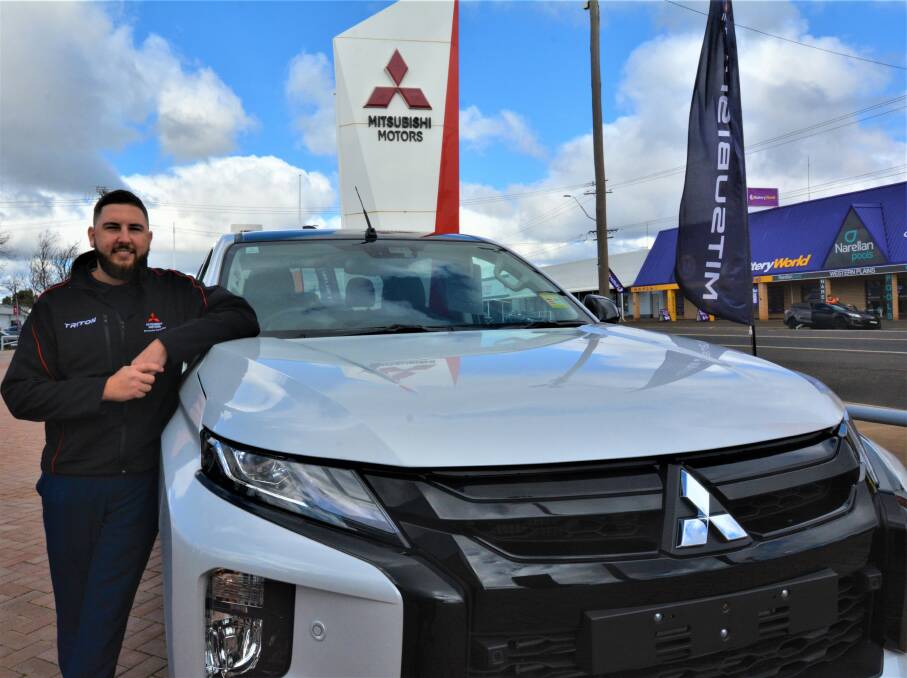 Western Plains Automotive sales manager Jacob Willetts with one of the top car brands he sells at their Dubbo showroom. Picture: Elizabeth Frias