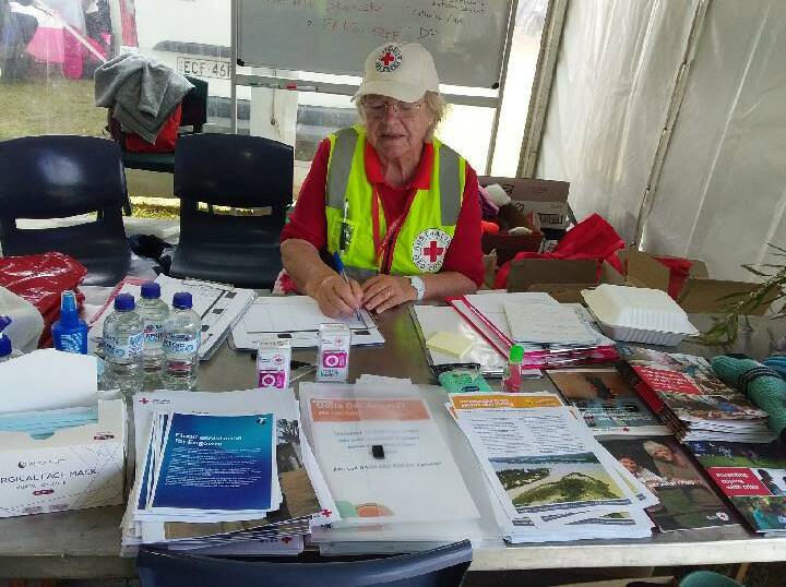 Red Cross Central West team member, June Hutchinson of Wellington at the Eugowra recovery hub in a tent. Picture Supplied