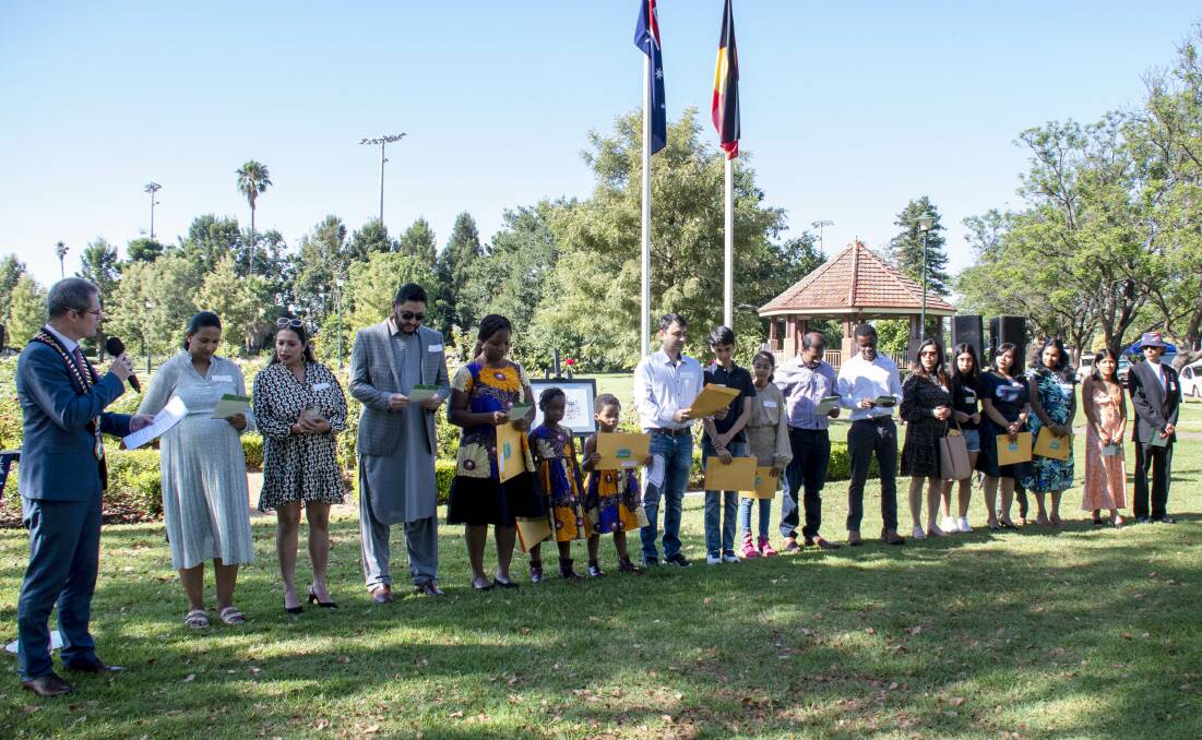 Dubbo mayor Mathew Dickerson (left) welcomes the new citizens at the Australi Day ceremony at Victoria Park on Thursday, January 26, 2023. Picture by Belinda Soole