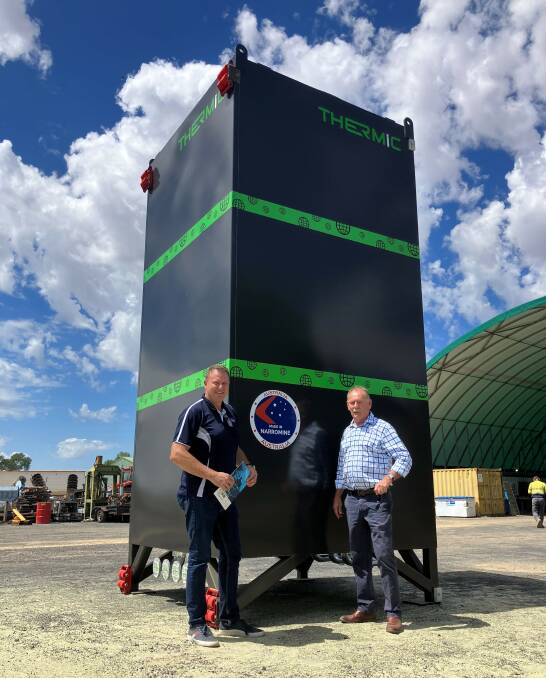 The Australian-made Thermic process heater, a homemade brand of Simmons Global is ready for shipment to a gold mining company in the Ivory Coast in West Africa, with Simmons Global owner David Simmons and Narromine mayor Craig Davies. Picture Supplied