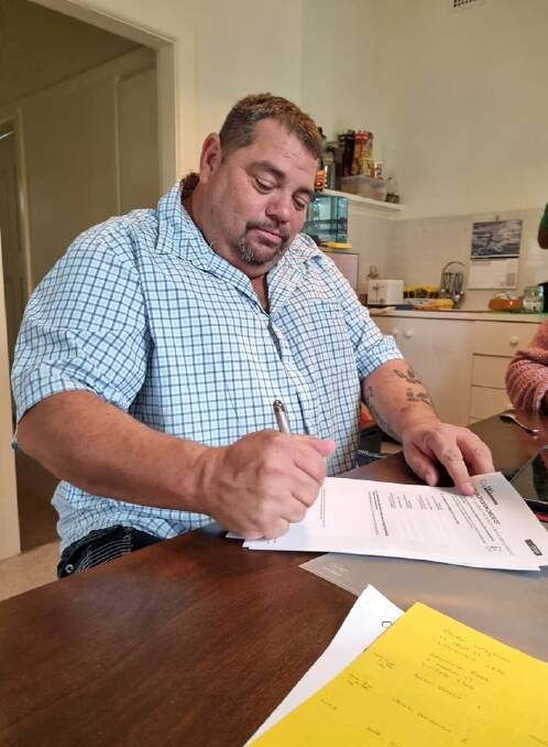 SIGNING IN: Derek Hardman signing his Australian Electoral Commission form in April. PICTURE: SUPPLIED
