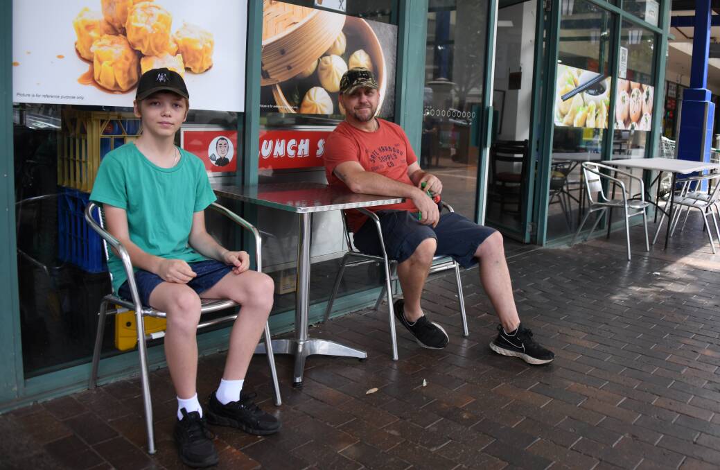 Andrew Hinton, pictured with son Alex at Mr Wang's Kitchen on Macquarie Street, spoke about the need for staff and customers to show each other respect. Picture by Amy McIntyre