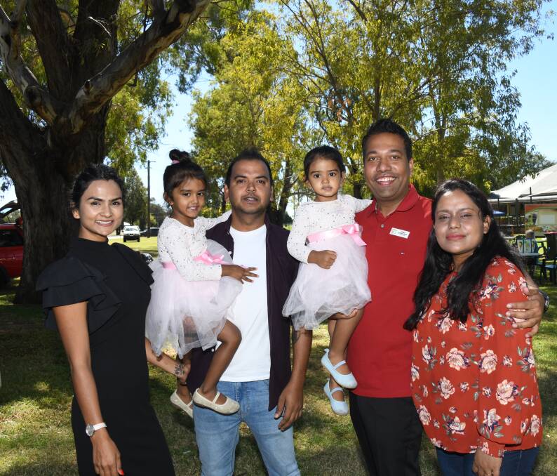 CONTENTED DUBBO FAMILIES: Lata Sharma and Raj Kharel with their children and Cr Shibli and Urmi Chowdhury. Picture: AMY MCINTYRE