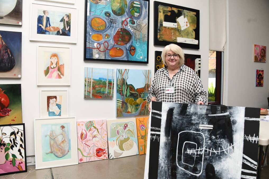 Ex-Myer creative designer Maria Oates with her mixed media pieces. Picture by Amy McIntyre