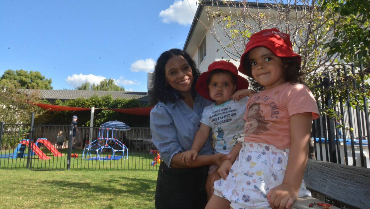 BENEFIT: Karoline Hughes with Leilani and Queenie at Redgum Childcare Centre on Fitzroy Street. PHOTO: ELIZABETH FRIAS