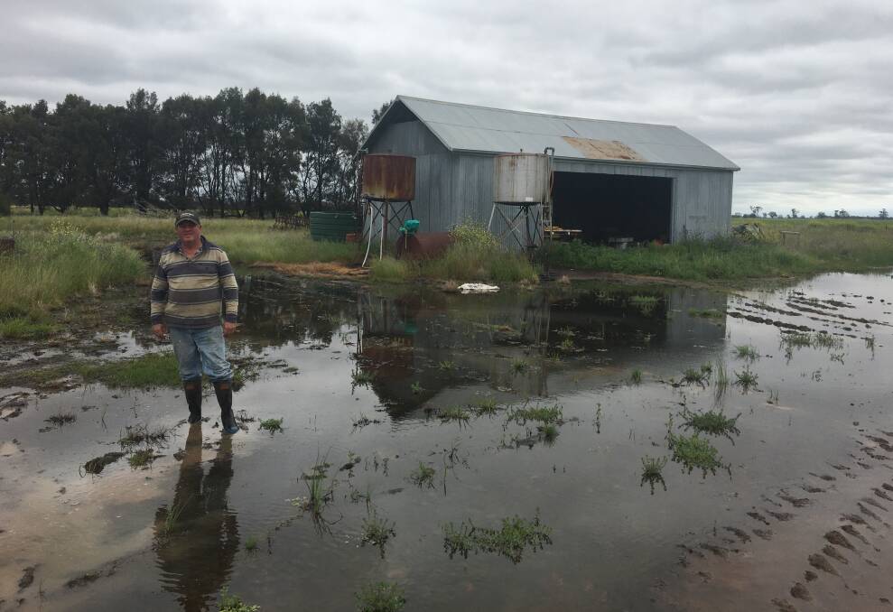Narromine farmer Scott Finemore standing on floodwater on his property taken on Thursday, October 6. Picture Supplied