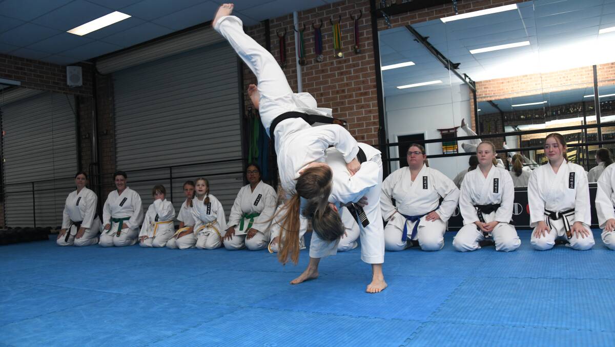 A self-defense technique taught by Kaisin Tekwondo instructor Kym Housden in a sparring match with Beatrice Reynolds Lamont. PHOTO: AMY MCINTYRE